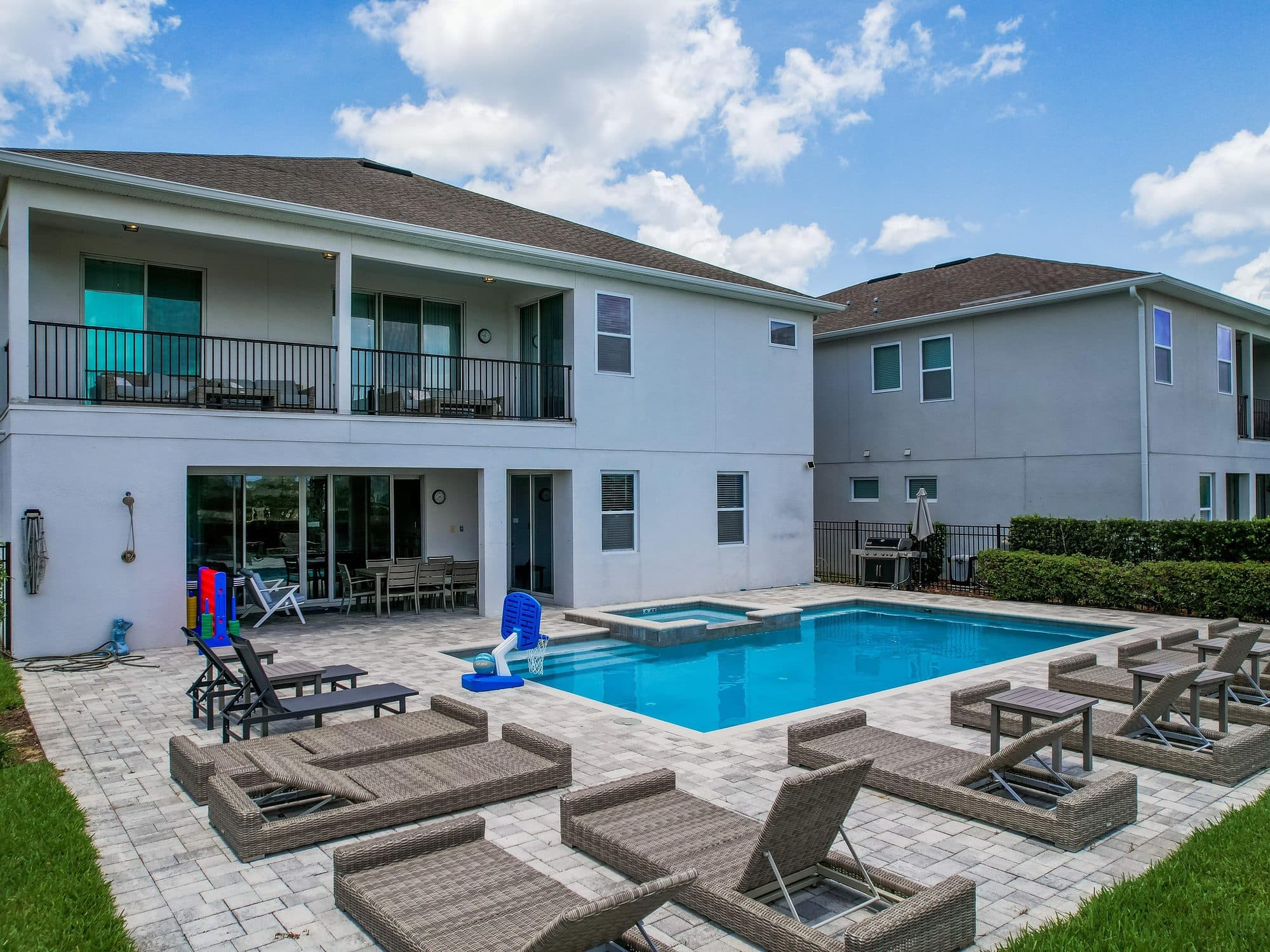 Private pool and paver deck with lounge seating at a resort community vacation rental near Orlando