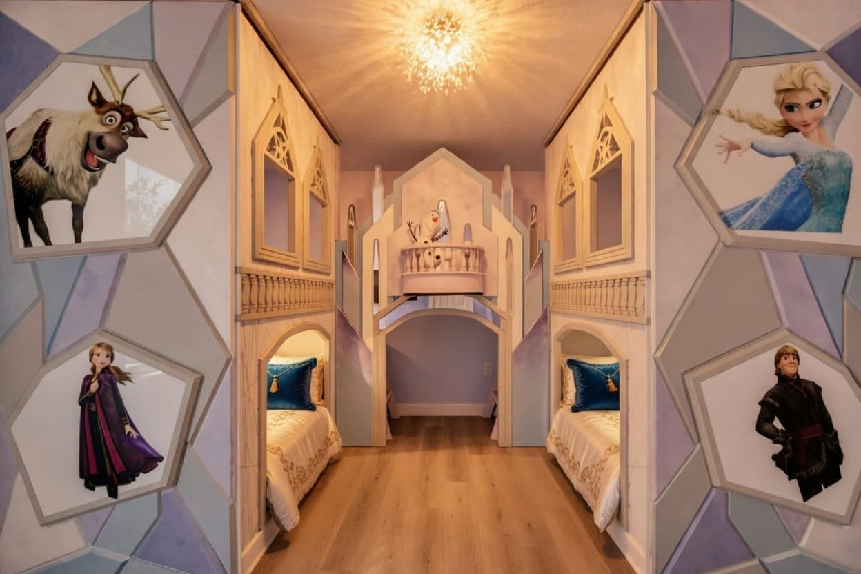 Sculpted themed hallway with carved wall panels and backlit detailing at a Kissimmee vacation rental
