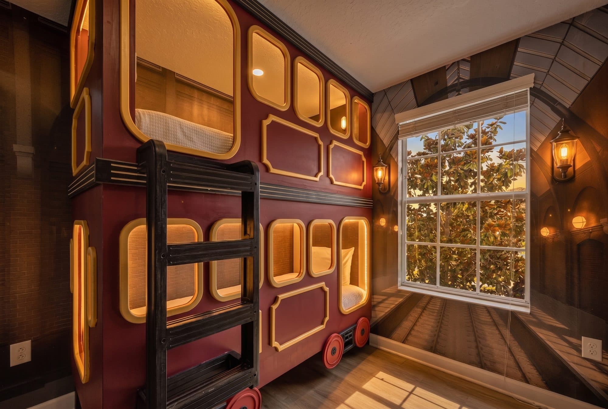 Custom-built train carriage bunk room with illuminated berths at an Orlando area themed vacation rental